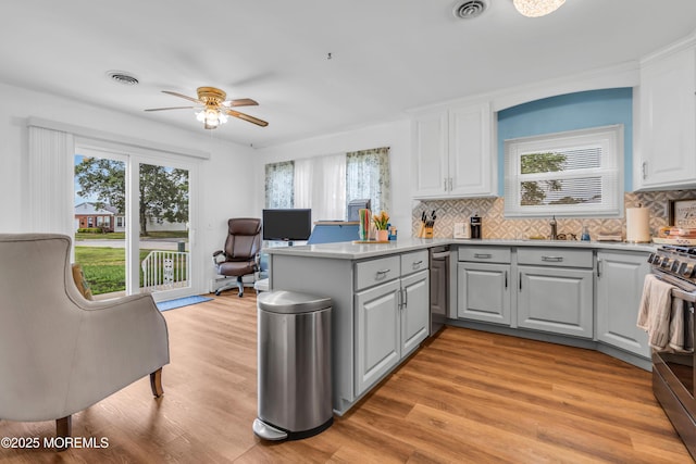 81 Encinitas Dr, Toms River, NJ 08757 - kitchen with gray cabinetry, ceiling fan, a sink, a peninsula, and backsplash