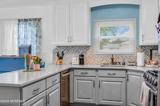 81 Encinitas Dr, Toms River, NJ 08757 - kitchen with gas stove, a sink, light countertops, and white cabinets