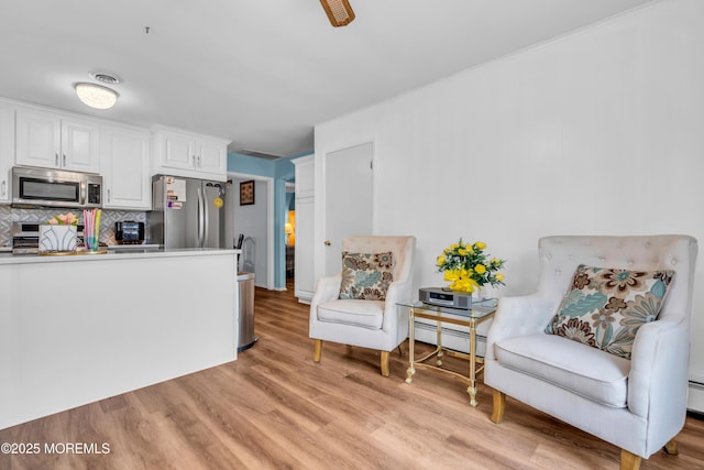 81 Encinitas Dr, Toms River, NJ 08757 - sitting room featuring a baseboard radiator and light wood-type flooring