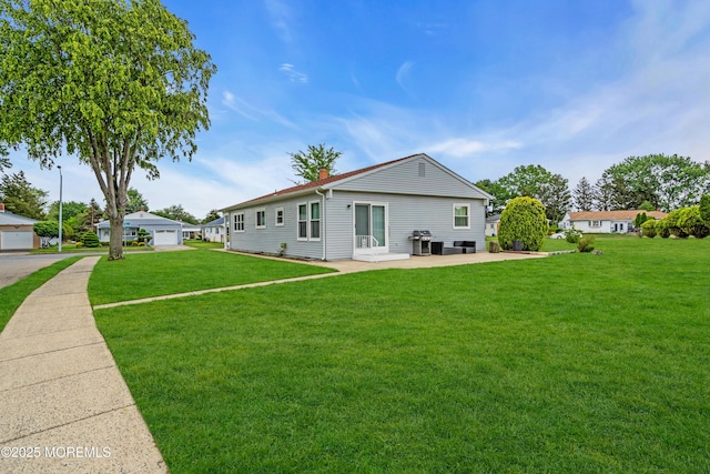 81 Encinitas Dr, Toms River, NJ 08757 - rear view of property featuring a yard, a chimney, and a patio