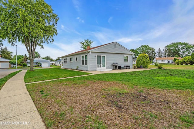 81 Encinitas Dr, Toms River, NJ 08757 - back of house with a yard, a chimney, and a patio area
