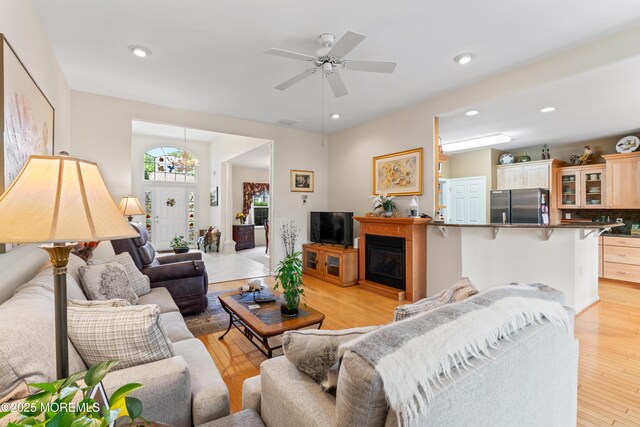 67 Isabella Dr, Manchester, NJ 08759 - living area featuring light wood-style floors, recessed lighting, a ceiling fan, and a glass covered fireplace