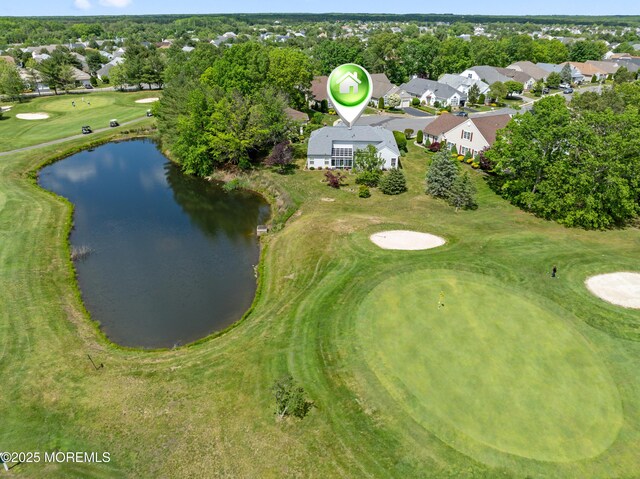 67 Isabella Dr, Manchester, NJ 08759 - aerial view of property and surrounding area featuring nearby suburban area, a golf club, a large body of water, and a tree filled landscape