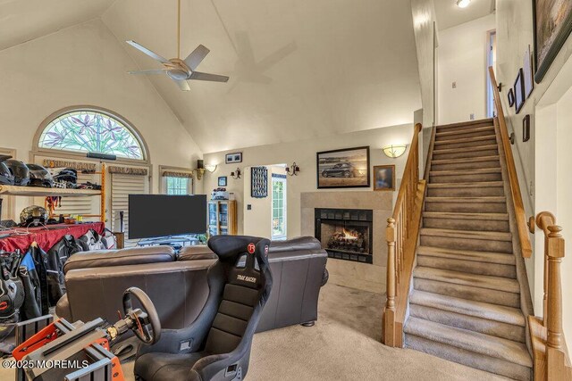 9 Rachel Ct, Jackson, NJ 08527 - carpeted living area featuring high vaulted ceiling, a ceiling fan, stairs, and a warm lit fireplace