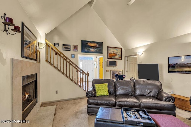 9 Rachel Ct, Jackson, NJ 08527 - carpeted living area featuring stairs, high vaulted ceiling, a fireplace with flush hearth, and baseboards