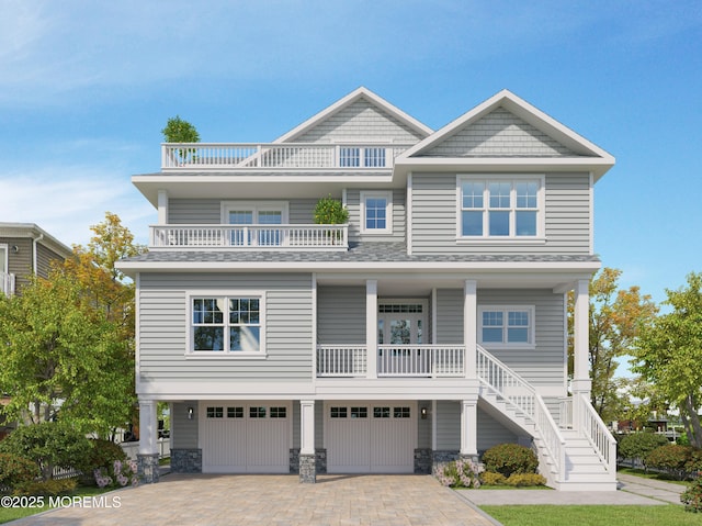 108 Rochester Dr, Brick, NJ 08723 - view of front of house featuring a balcony, a garage, stairway, decorative driveway, and covered porch