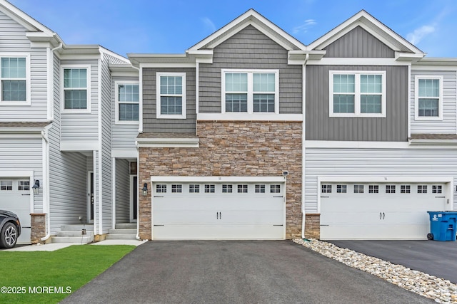 38 Mantoloking Dr, Jackson, NJ 08527 - townhome / multi-family property featuring stone siding, asphalt driveway, and an attached garage