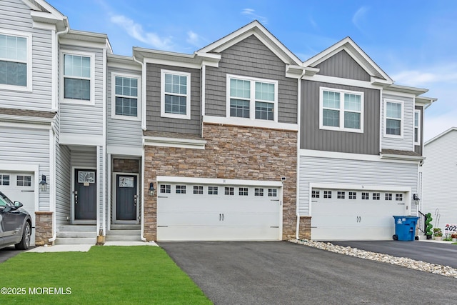 38 Mantoloking Dr, Jackson, NJ 08527 - view of property with stone siding, driveway, a garage, and board and batten siding