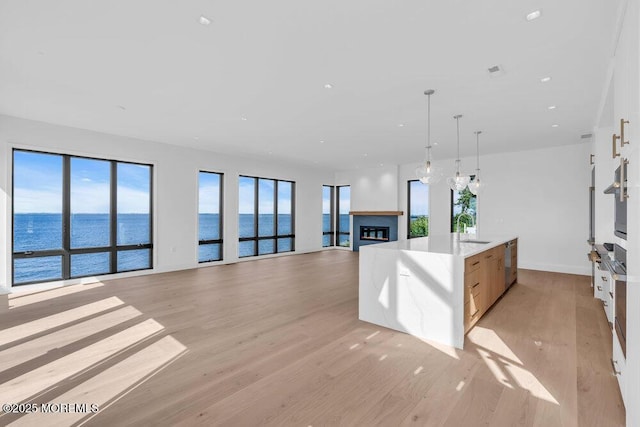 2 Brant Dr Lot 5.01, Atlantic Highlands, NJ 07716 - kitchen featuring modern cabinets, light wood-type flooring, a water view, open floor plan, and pendant lighting