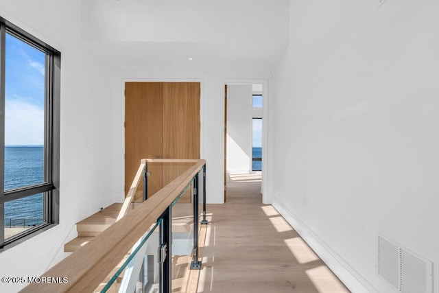 2 Brant Dr Lot 5.01, Atlantic Highlands, NJ 07716 - hallway featuring plenty of natural light, a water view, and light wood-style flooring