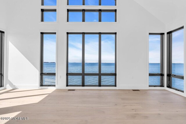 2 Brant Dr Lot 5.01, Atlantic Highlands, NJ 07716 - spare room featuring a water view, wood finished floors, and high vaulted ceiling
