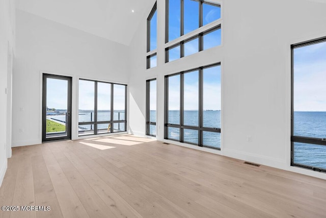 2 Brant Dr Lot 5.01, Atlantic Highlands, NJ 07716 - unfurnished room featuring a water view, plenty of natural light, a high ceiling, and wood finished floors