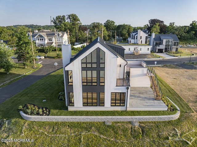 2 Brant Dr Lot 5.01, Atlantic Highlands, NJ 07716 - back of property featuring a residential view, a lawn, and a chimney