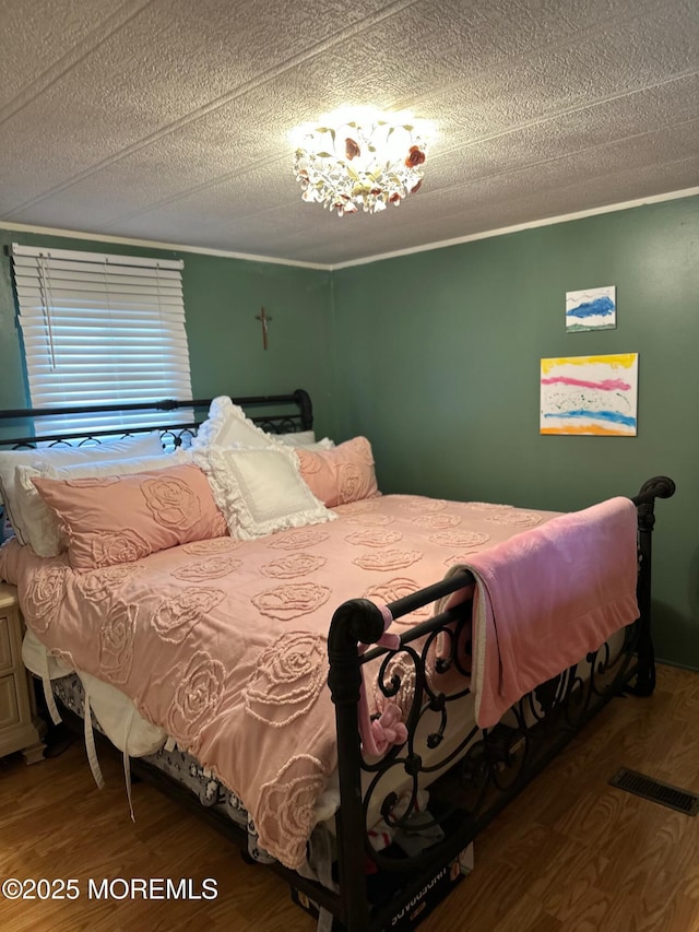 138 Oak Dr, Manchester, NJ 08759 - bedroom featuring wood finished floors and a textured ceiling