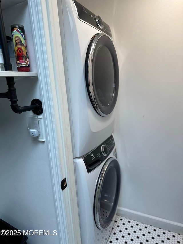 138 Oak Dr, Manchester, NJ 08759 - laundry area with estacked washer and dryer and baseboards