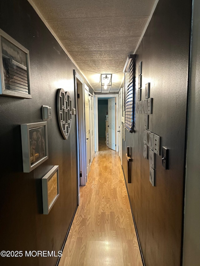 138 Oak Dr, Manchester, NJ 08759 - corridor with a textured ceiling and light wood-style floors