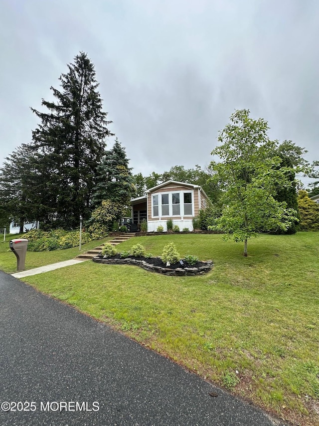 138 Oak Dr, Manchester, NJ 08759 - view of front of house featuring a front yard