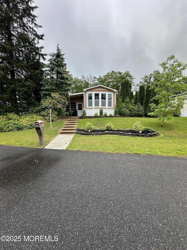 138 Oak Dr, Manchester, NJ 08759 - view of front of house featuring a front yard