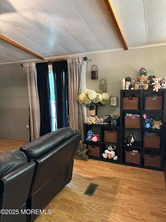 138 Oak Dr, Manchester, NJ 08759 - misc room featuring wood finished floors, lofted ceiling, ornamental molding, and a textured ceiling