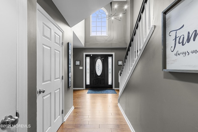 1 Kennedy Ct, Jackson, NJ 08527 - foyer with a chandelier, high vaulted ceiling, stairway, baseboards, and hardwood / wood-style flooring