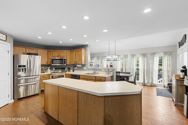 1 Kennedy Ct, Jackson, NJ 08527 - kitchen featuring stainless steel appliances, light countertops, a sink, recessed lighting, and light wood-style flooring