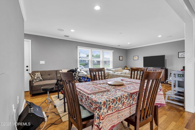 18 Delaware Ave, West Long Branch, NJ 07764 - dining area with light wood finished floors, ornamental molding, and recessed lighting