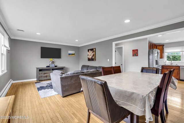 20 Delaware Ave, West Long Branch, NJ 07764 - dining space featuring light wood-type flooring, recessed lighting, ornamental molding, and baseboard heating
