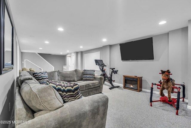 20 Delaware Ave, West Long Branch, NJ 07764 - carpeted living room with recessed lighting, stairway, and a glass covered fireplace