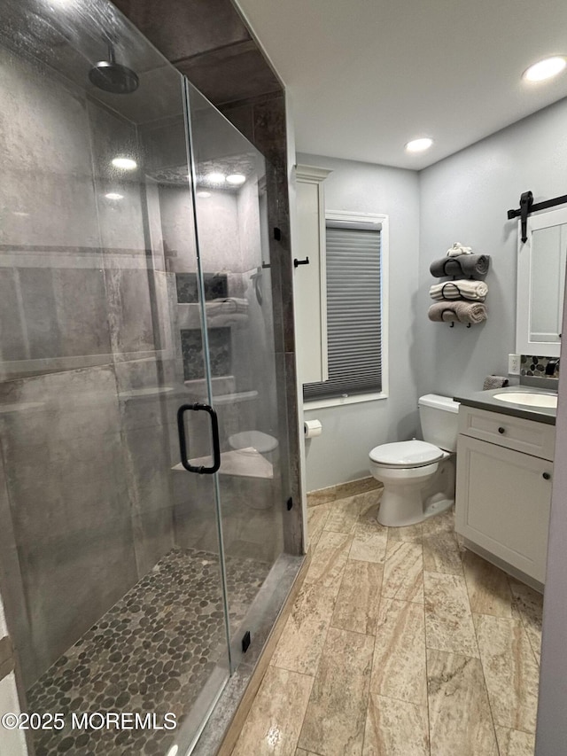 56 Turnberry Cir Unit 138, Toms River, NJ 08753 - bathroom with vanity, toilet, a shower stall, and recessed lighting