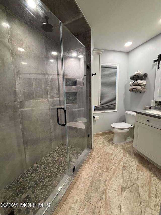 56 Turnberry Cir Unit 138, Toms River, NJ 08753 - bathroom with vanity, a stall shower, toilet, and recessed lighting