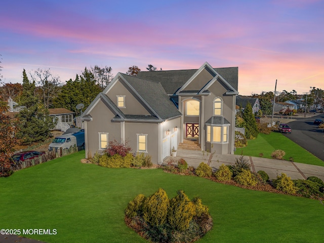 13 Cedar Tree Ln, Toms River, NJ 08753 - traditional-style home featuring a front lawn, stucco siding, an attached garage, and concrete driveway