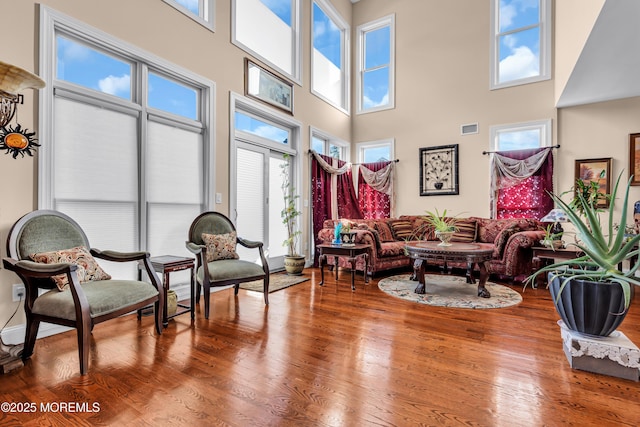 13 Cedar Tree Ln, Toms River, NJ 08753 - living room with healthy amount of natural light, a high ceiling, and wood finished floors