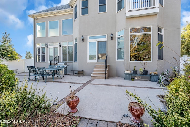 13 Cedar Tree Ln, Toms River, NJ 08753 - back of property with stucco siding, a patio, entry steps, and a balcony