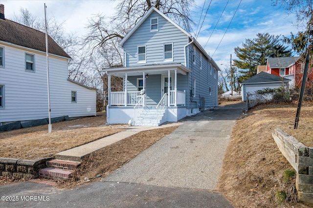 31 Smullen St, Sayreville, NJ 08872 - view of front of house with covered porch and driveway