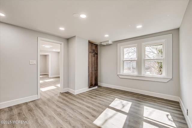 31 Smullen St, Sayreville, NJ 08872 - unfurnished bedroom with light wood-type flooring, baseboards, and recessed lighting