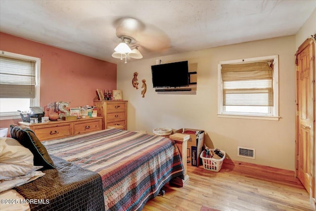 4 Calt Dr, Hazlet, NJ 07730 - bedroom with multiple windows, wood finished floors, and ceiling fan