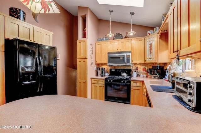 4 Calt Dr, Hazlet, NJ 07730 - kitchen featuring black appliances, light brown cabinets, a skylight, lofted ceiling, and a sink