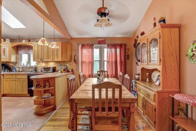 4 Calt Dr, Hazlet, NJ 07730 - dining room featuring lofted ceiling, ceiling fan, a skylight, and light wood-type flooring