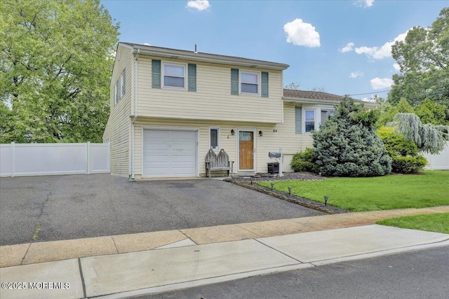 4 Calt Dr, Hazlet, NJ 07730 - split level home with an attached garage and driveway