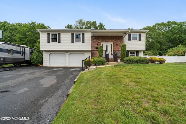 20 Sugarbush Rd, Howell, NJ 07731 - split foyer home featuring driveway, an attached garage, and brick siding