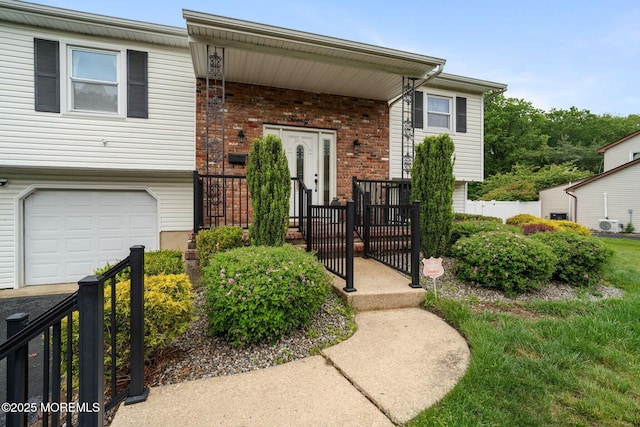 20 Sugarbush Rd, Howell, NJ 07731 - view of front of house featuring a garage and brick siding