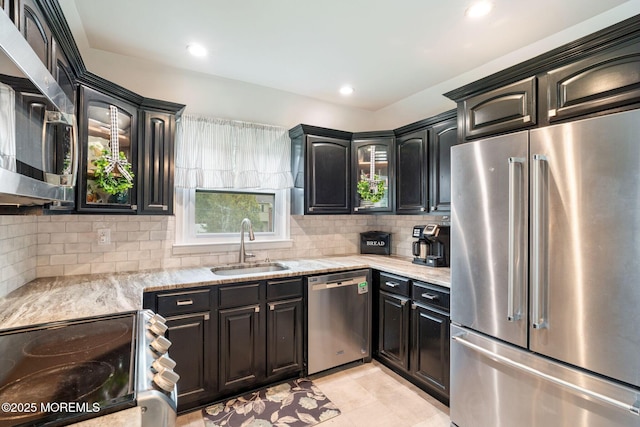 20 Sugarbush Rd, Howell, NJ 07731 - kitchen featuring stainless steel appliances, a sink, backsplash, light stone counters, and plenty of natural light