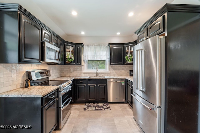 20 Sugarbush Rd, Howell, NJ 07731 - kitchen with stainless steel appliances, a sink, backsplash, recessed lighting, and dark cabinetry