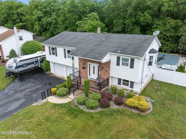 20 Sugarbush Rd, Howell, NJ 07731 - split level home with roof with shingles, driveway, and a garage