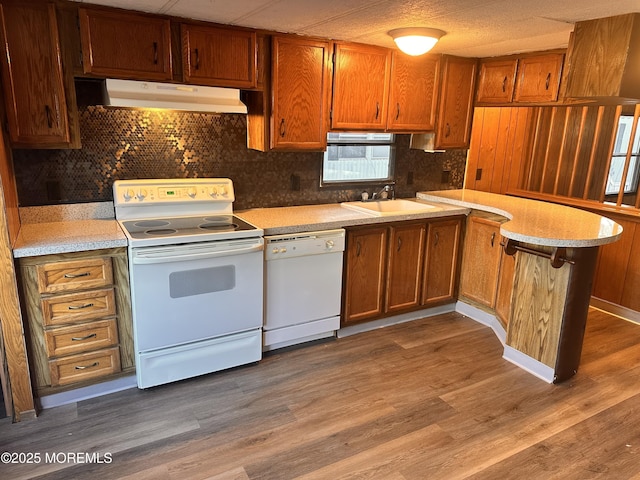 5 Eagle Ct, Whiting, NJ 08759 - kitchen featuring white appliances, under cabinet range hood, brown cabinets, and light countertops