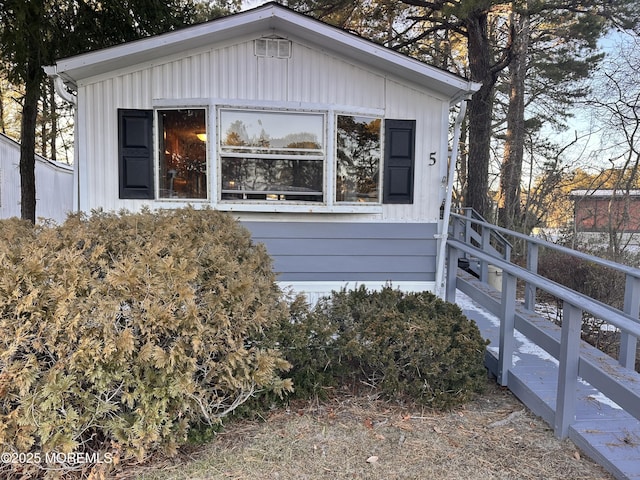 5 Eagle Ct, Whiting, NJ 08759 - view of side of home featuring board and batten siding