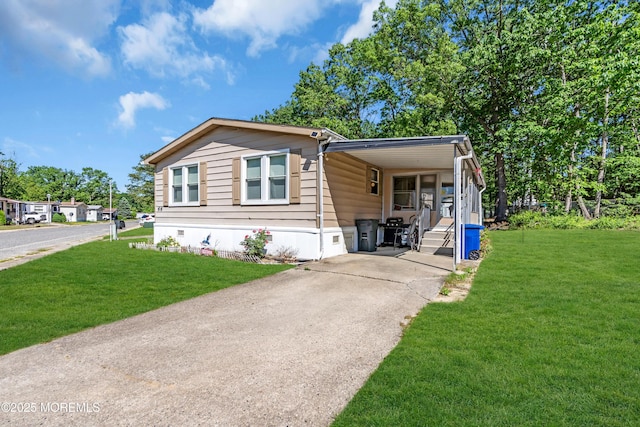 66 Douglas Dr, Jackson, NJ 08527 - manufactured / mobile home with concrete driveway, crawl space, a carport, and a front yard