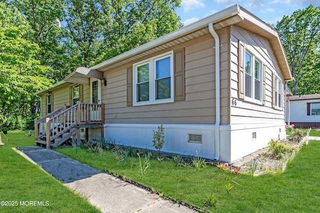 66 Douglas Dr, Jackson, NJ 08527 - view of front facade featuring crawl space and a front yard