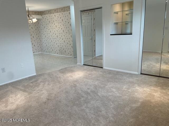8 Indiana Ct Unit 1016, Matawan, NJ 07747 - unfurnished bedroom featuring carpet flooring, two closets, and baseboards