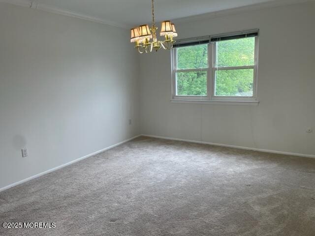8 Indiana Ct Unit 1016, Matawan, NJ 07747 - carpeted empty room with a chandelier, baseboards, and ornamental molding